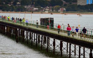 Pier in 2017 with many people and the train